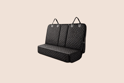 Quilted black pet car seat cover with straps for backseat protection and easy installation.